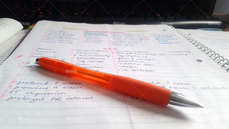 Writing Nursing Notes with an Orange Pen