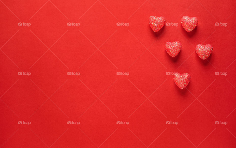 Postcard. Red hearts on a red background. Valentine's Day.