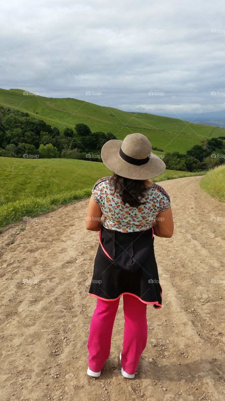 Lady in a hat,  enjoying the view