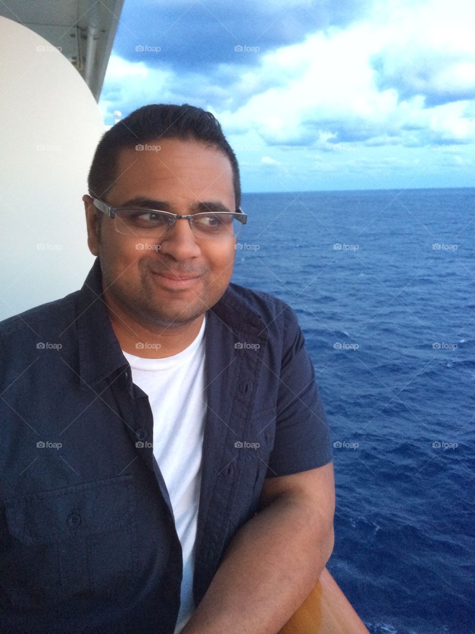 Sri Lankan American making silly faces on a Norwegian cruise balcony en route to Bermuda. Taken May 2014. 