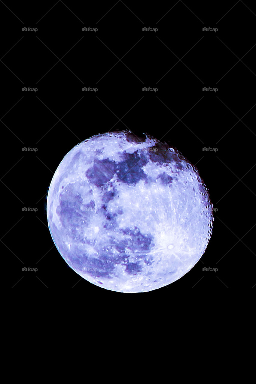 Night: Once in a blue moon?? This nighttime shot of a just past full moon is completely real except for the slightly blue hue. A real blue moon would the 2nd full moon in one calendar month. Still beautiful? I think so!!! ๐