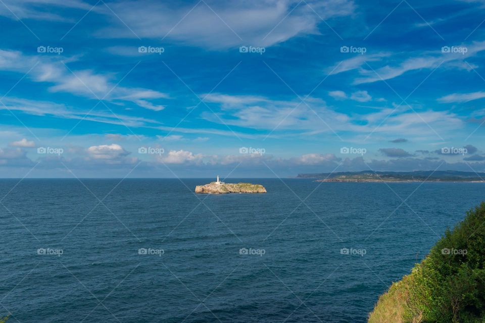 View of Mouro Island and lighthouse at Santander Bay. Cantabria, Spain.