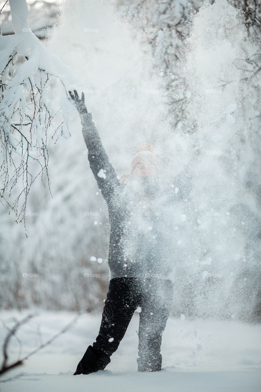 Funny girl portrait with snow