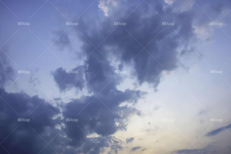 The beauty of the sky with clouds and the sun.