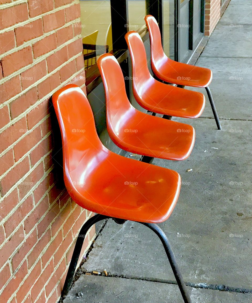 Orange Chairs & Brick Wall