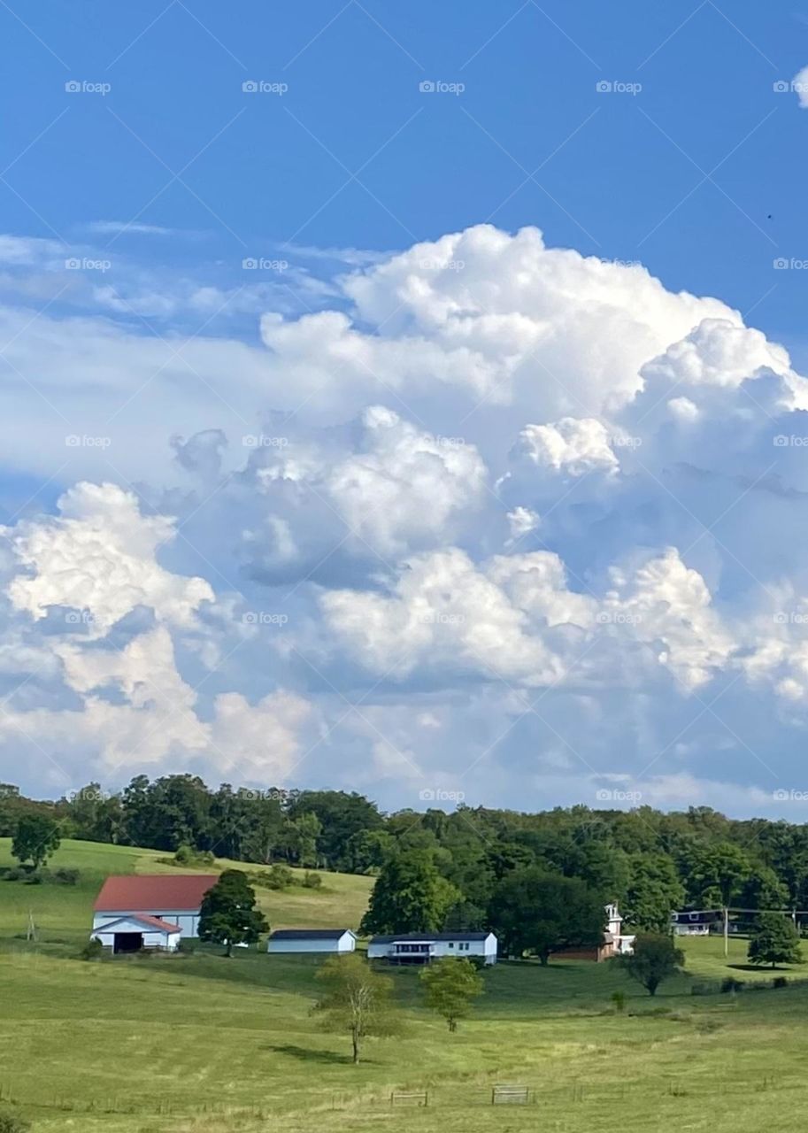 Beautiful fluffy white clouds with a vibrant blue sky 