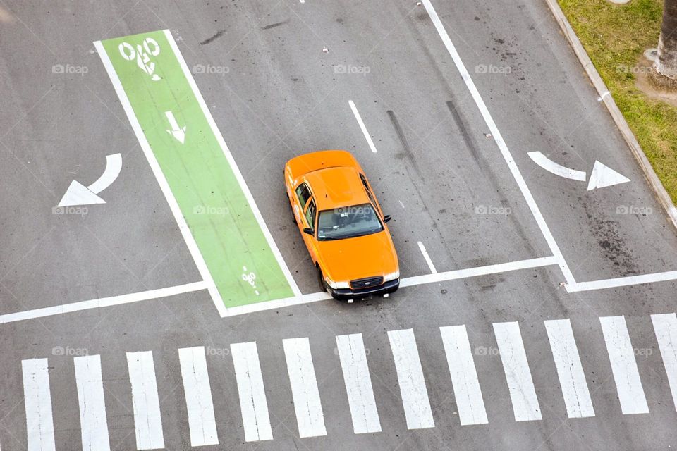 Yellow taxi on road