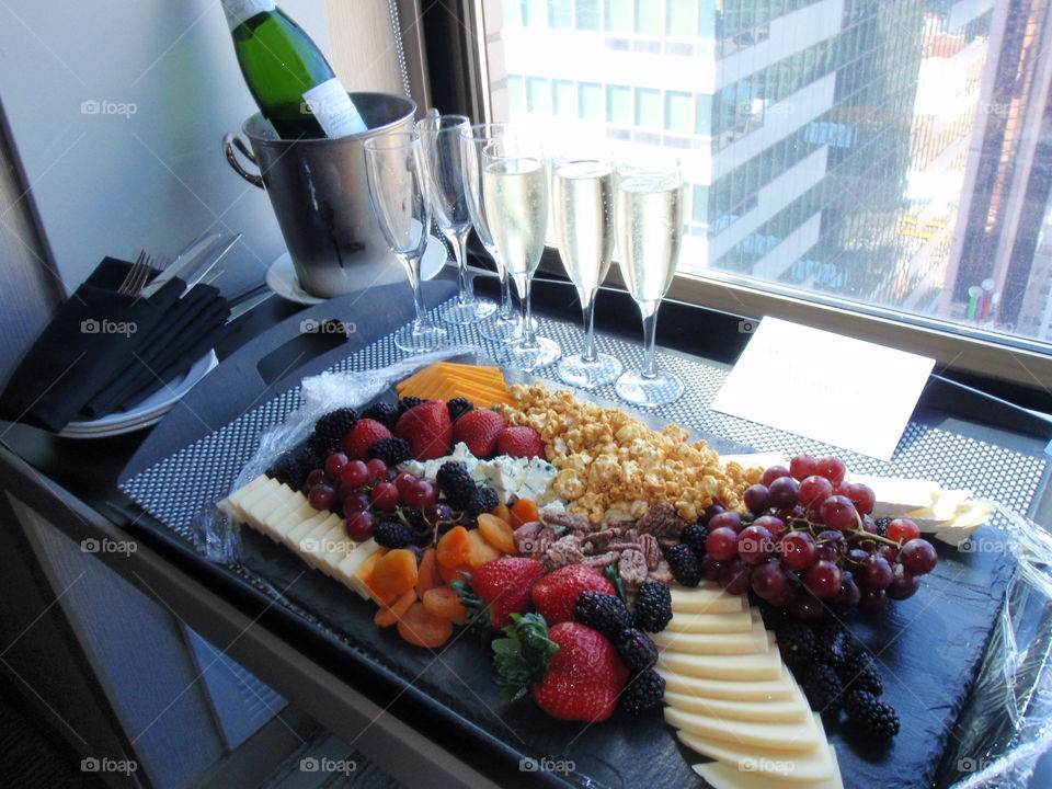 Now that's hospitality!. Beautiful tray of fruit and cheese with champagne 