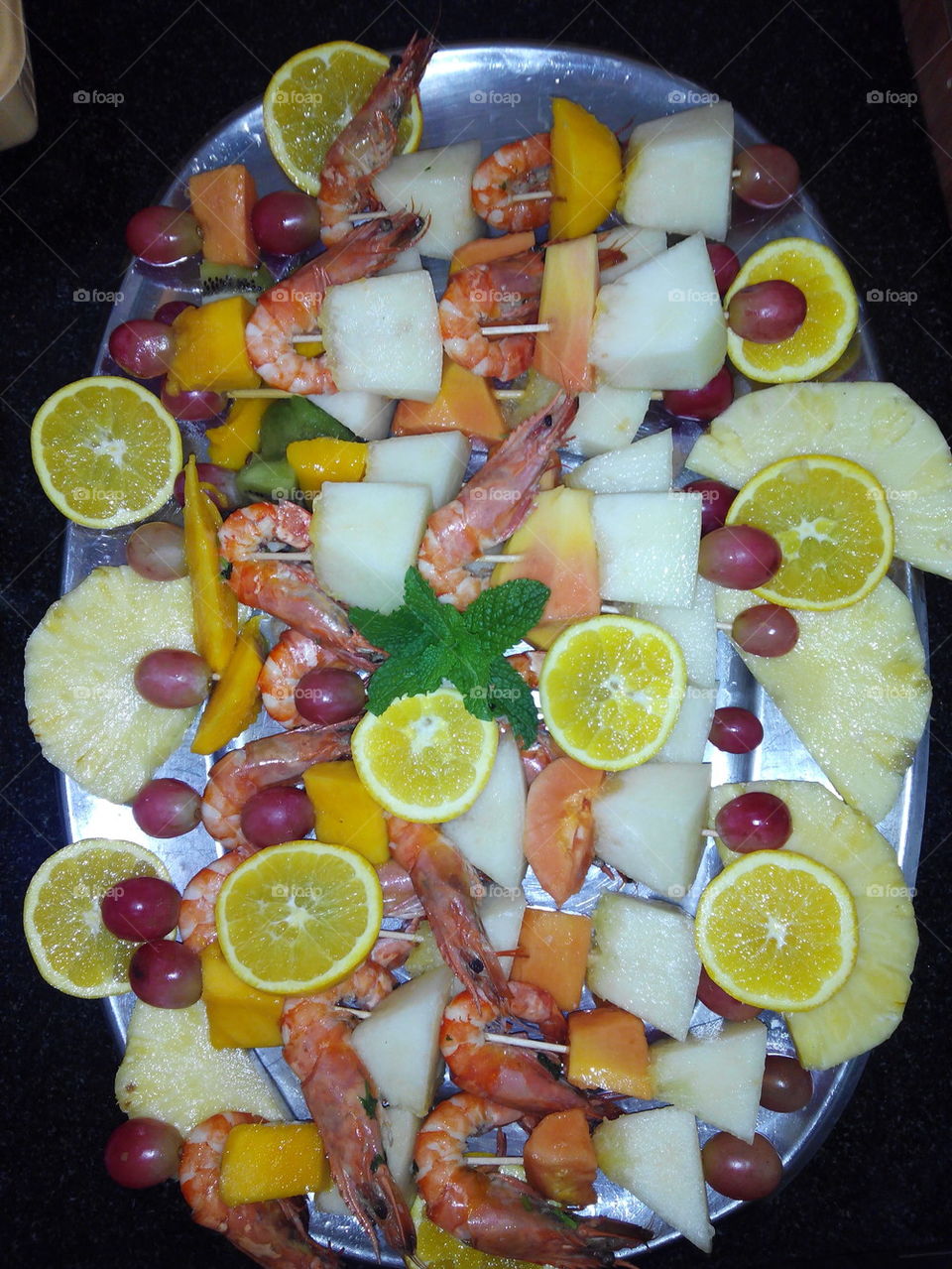Skewered shring with fruit