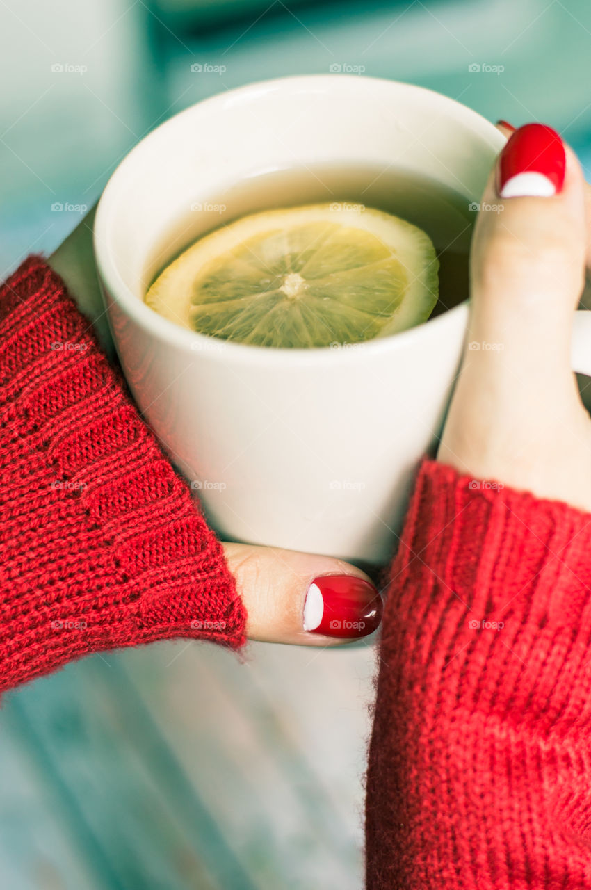 woman hand with cup of tea