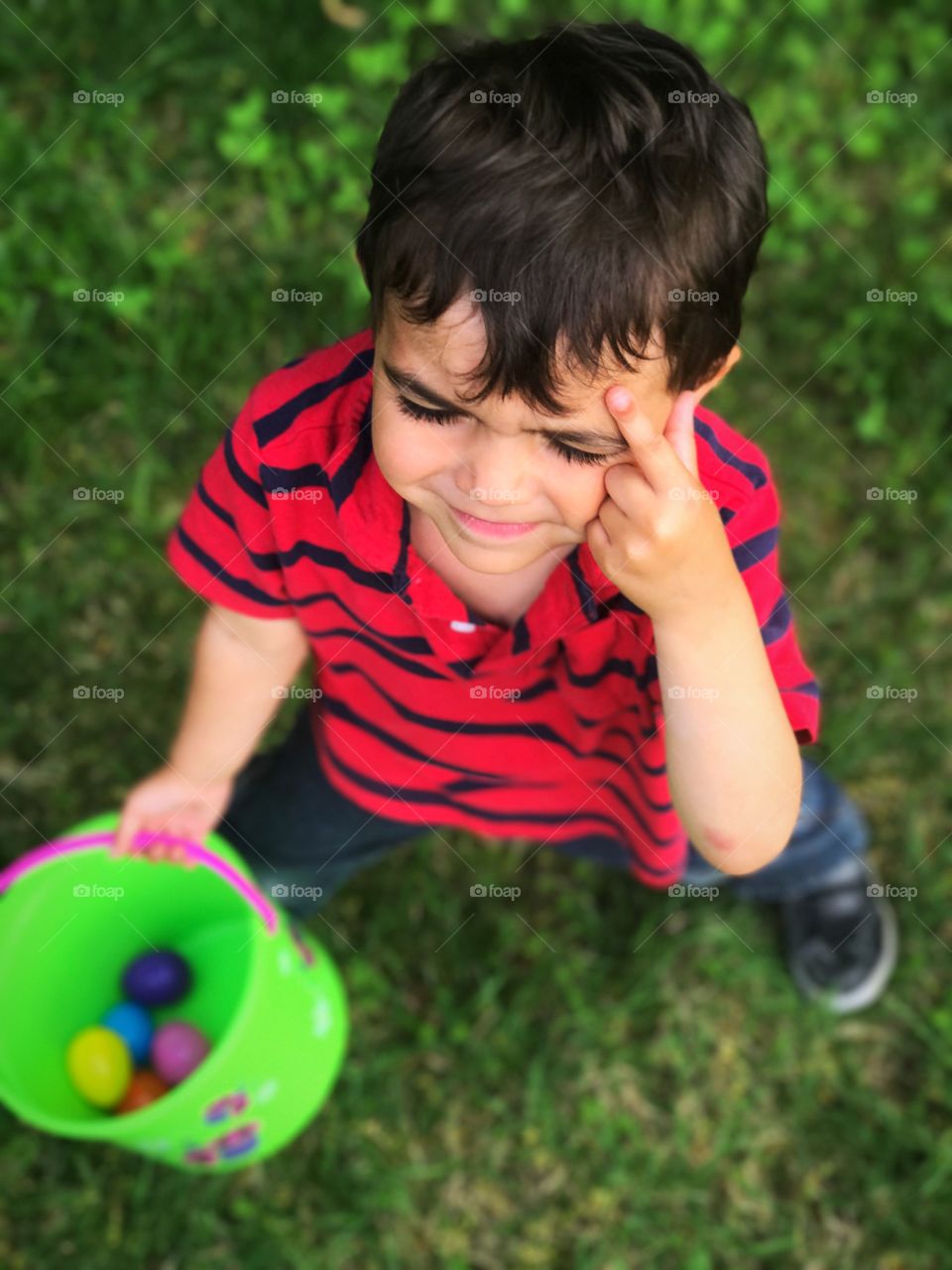 Little Boy Trying to Remember Where the Last Easter Egg Must Be Hidden