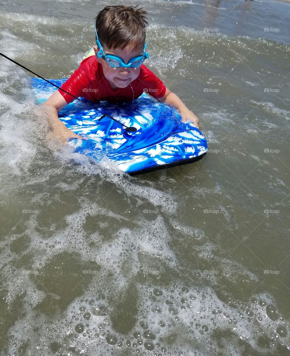 Child boogie boarding