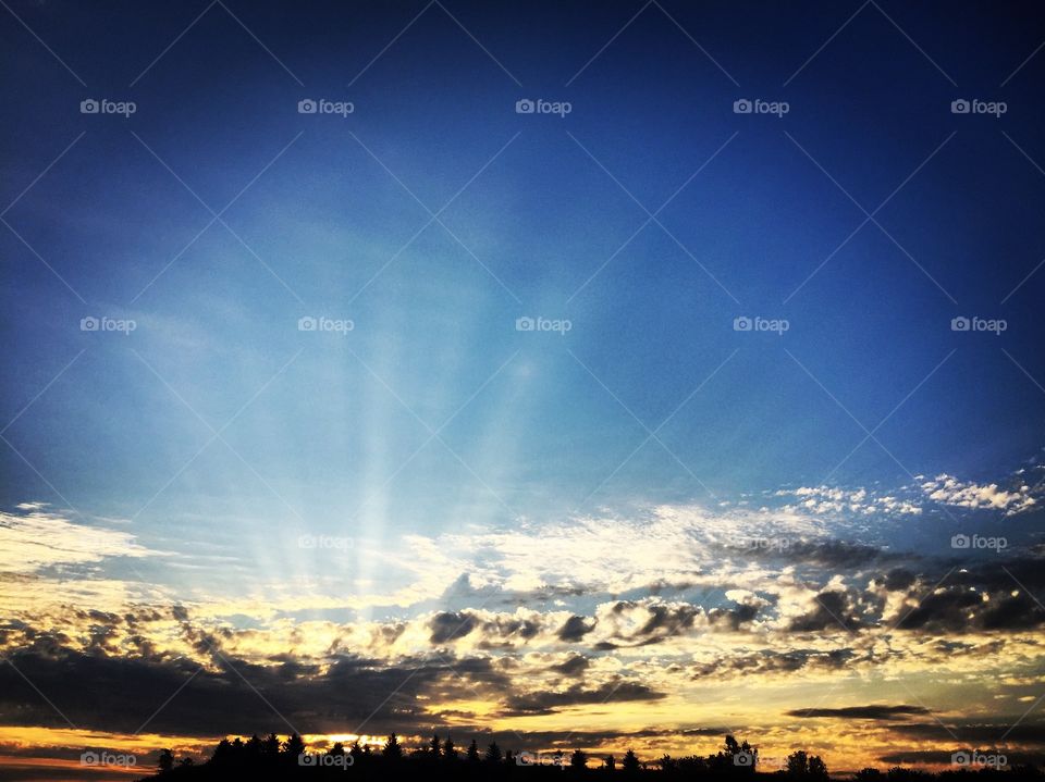 sun beams through the clouds