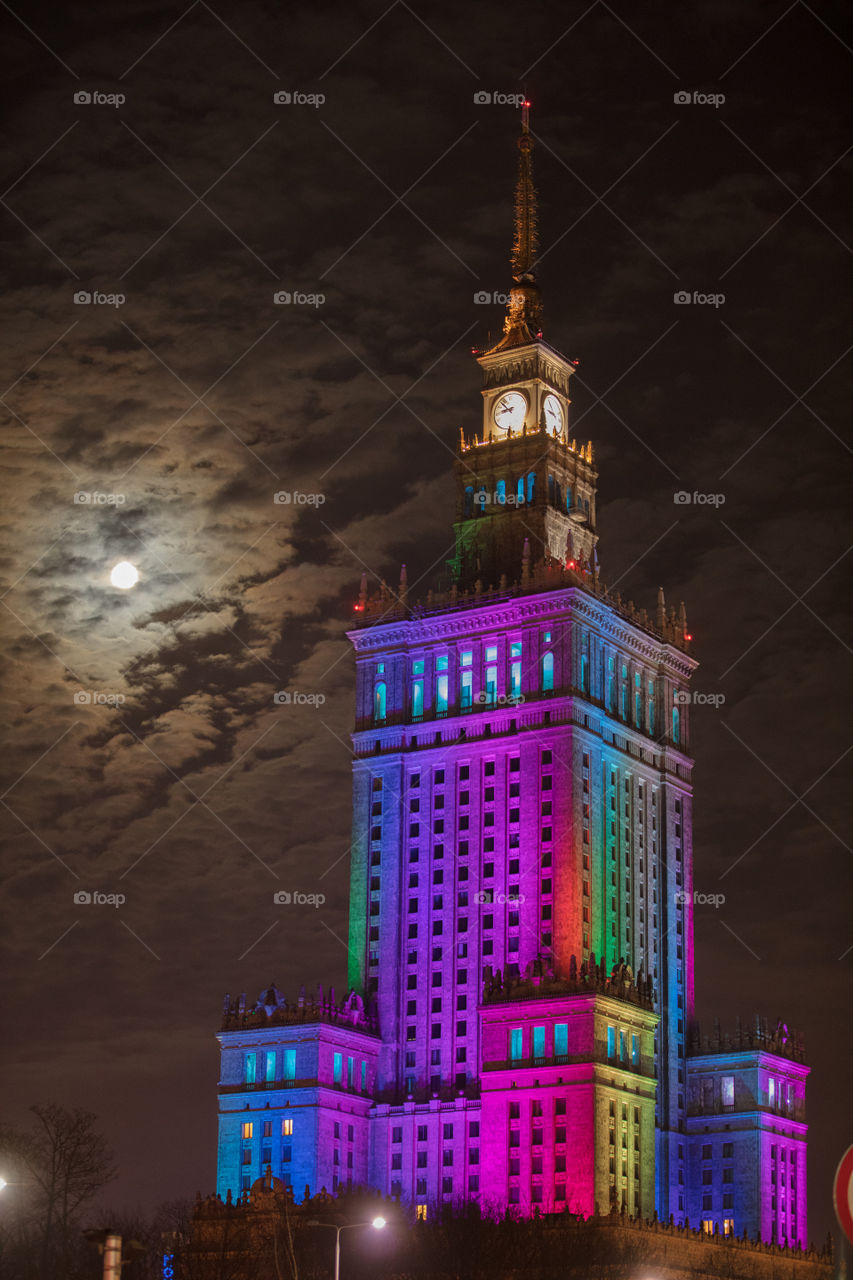 The one of tallest building in my neighbour, a relic of the past, was dressed in a rainbow of colors, the most visible sign of spring at that time at this latitude. To underline the uniqueness of this day, even the moon illuminated the entire city.