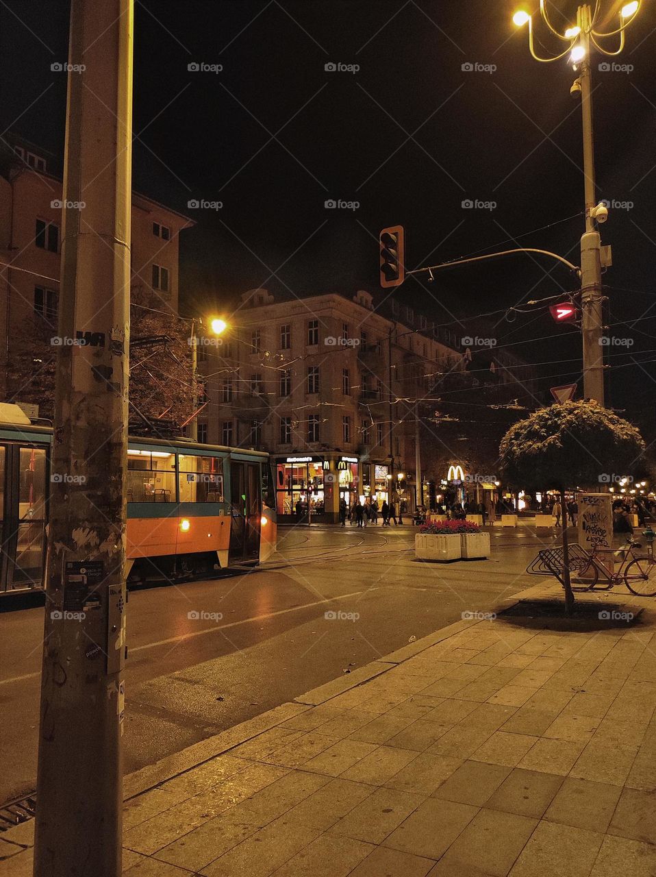 The centre of Sofia, Bulgaria / Centre of a capital city / Sofia at night / night life in a capital / tram in the evening / public transport and restaurants in the city