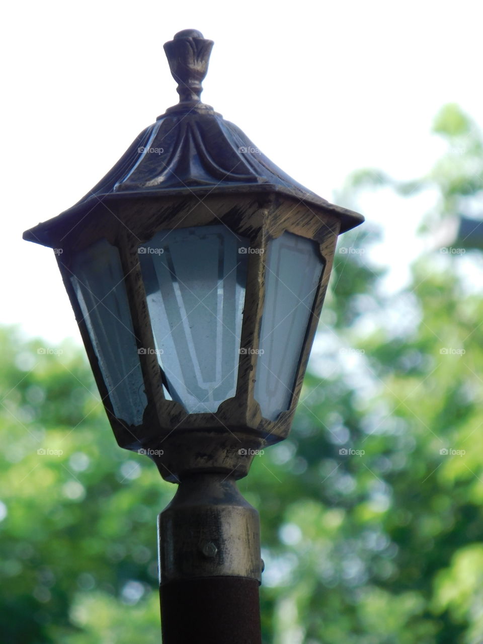 Light lamp at roadside with blurred bookeh background effect.