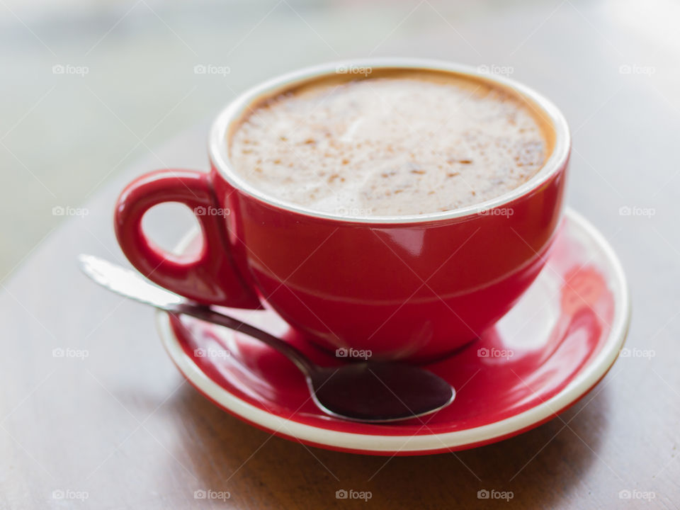 Close-up of coffee in red cup