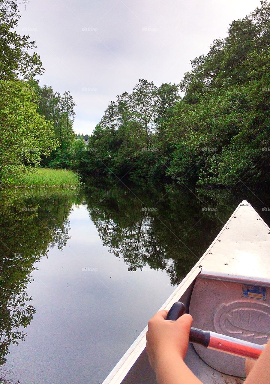 Canoeing. On the rive by canoe