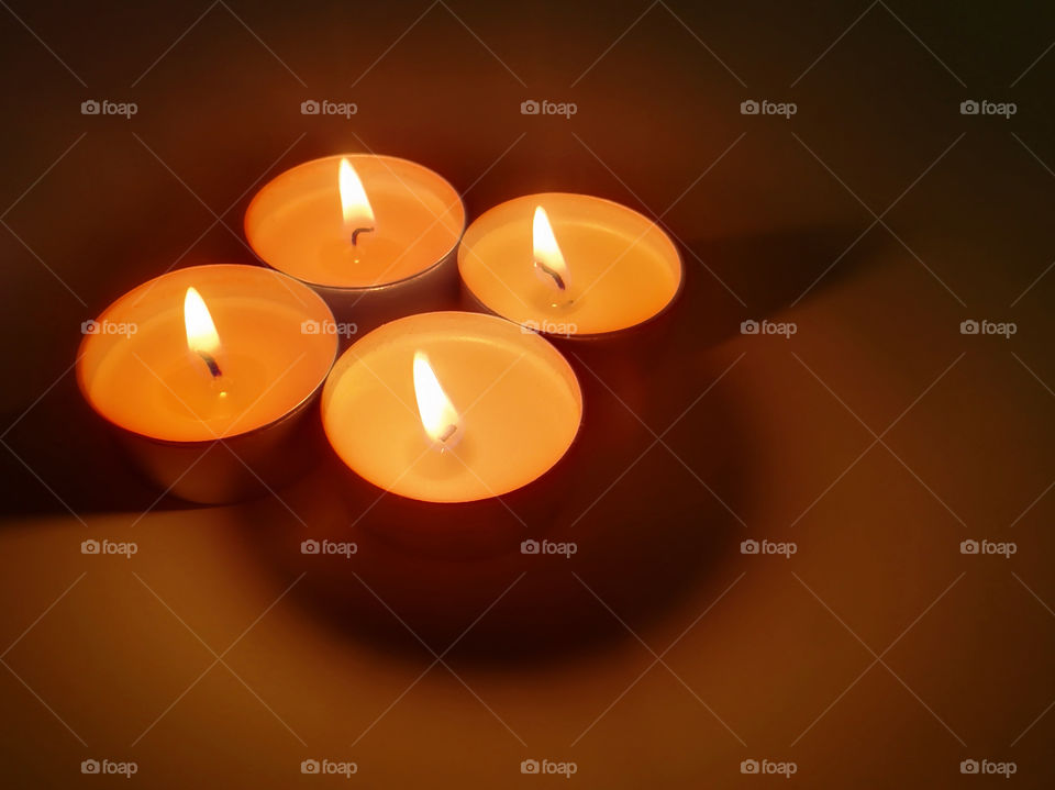 Tealight candles with blurred dark background