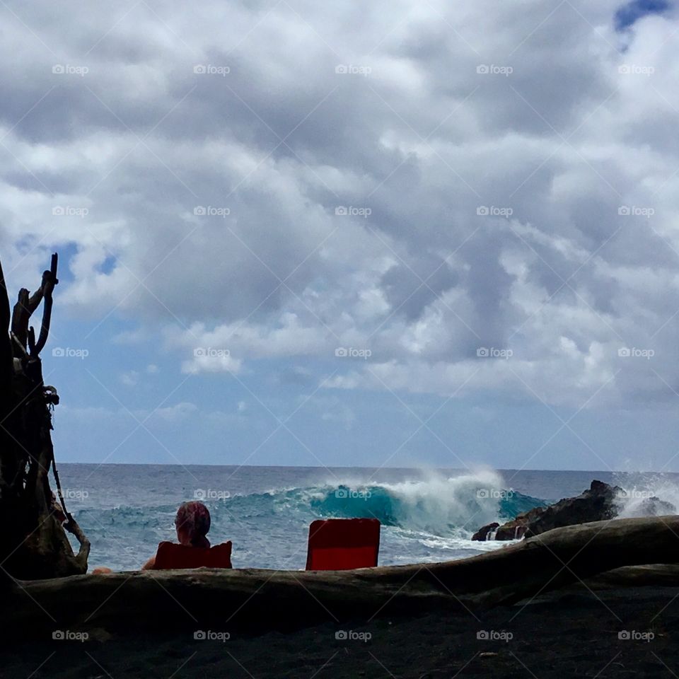 Enjoying the surf at the black sand beach