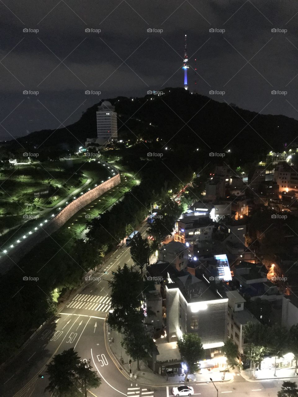 A night snap of Seoul in an August summer evening, with the TV tower lit up in the distance 