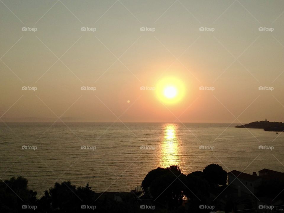 Sunset at sea, horizon over water