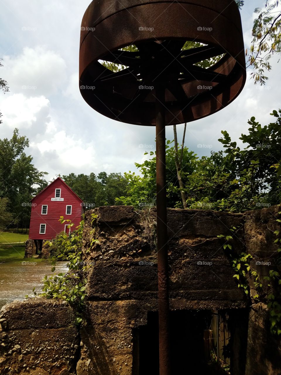 under the falls at the old mill