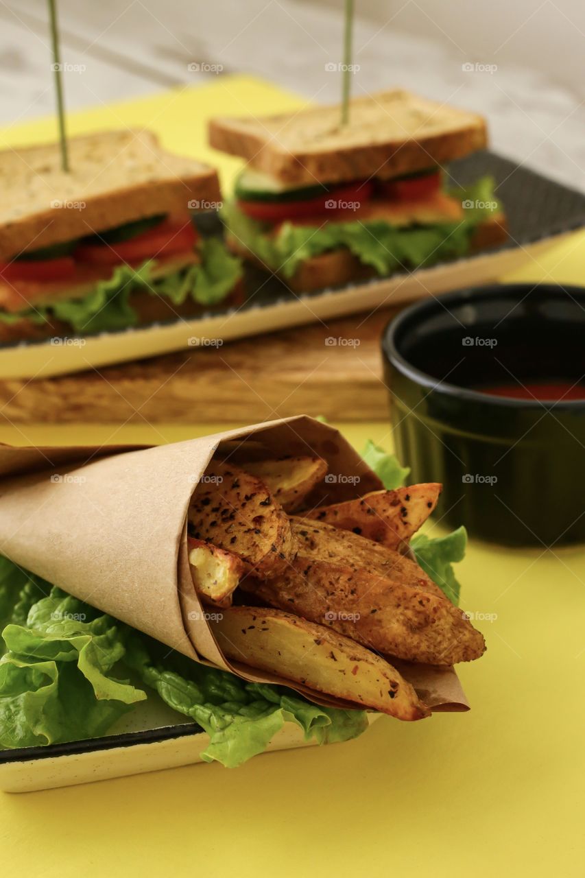 fried homemade potato and sandwiches with tomato ketchup