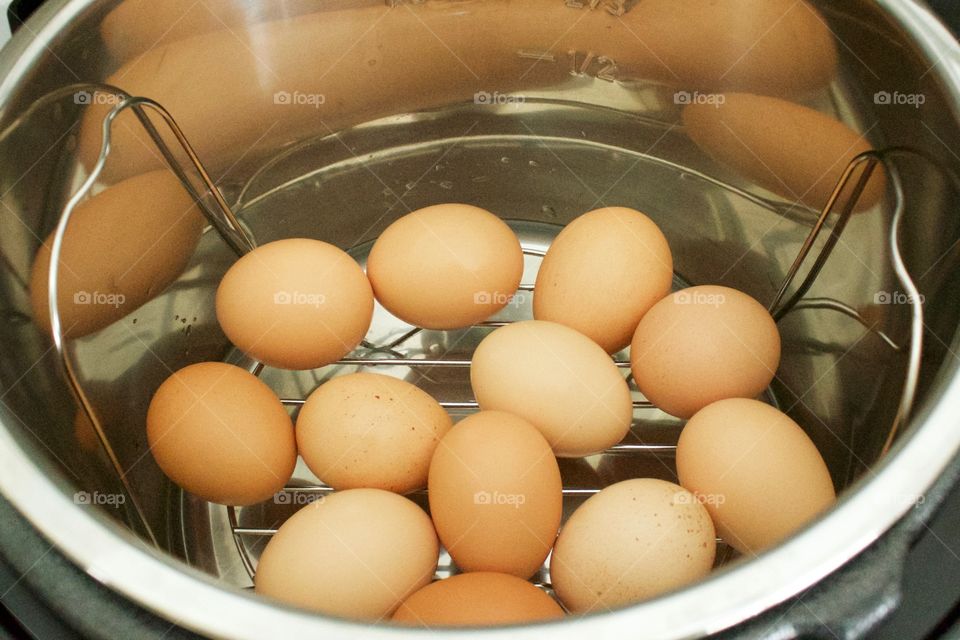 Farm fresh eggs on a trivet in an electric pressure cooker