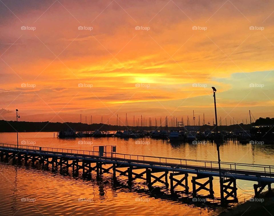 Spectacular sunset over the marina - Sunset is the most beautiful when it draws to a close and the light  is illuminated before into the promises of darkness