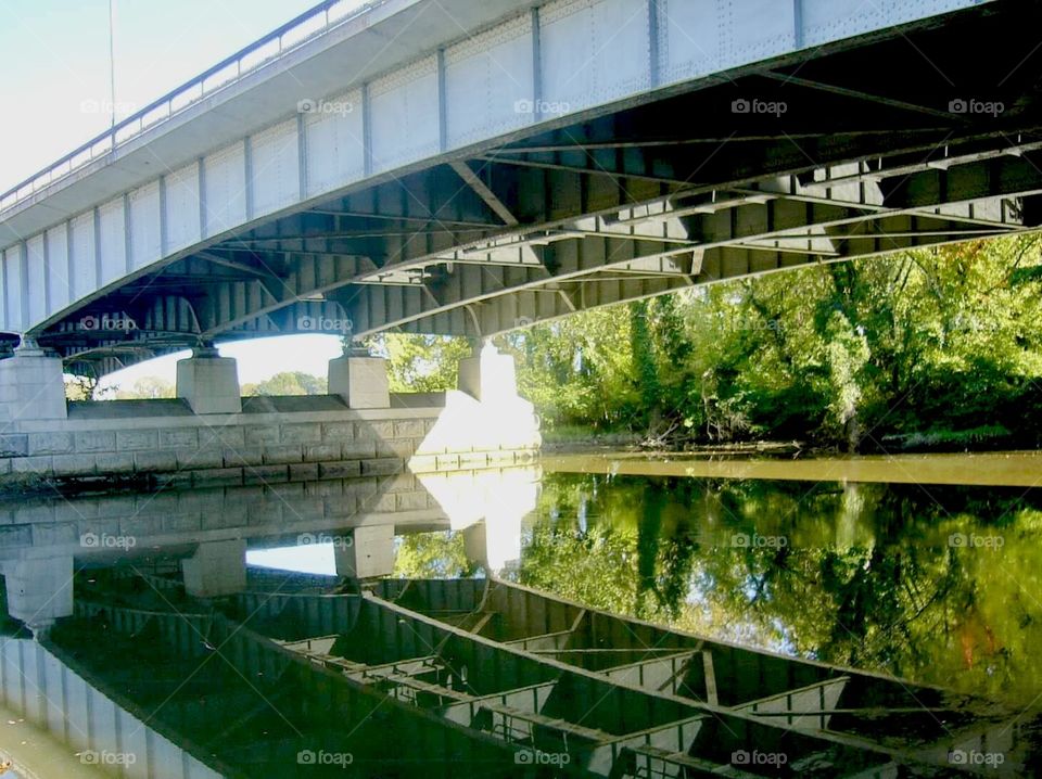 Under the bridge reflection in the water