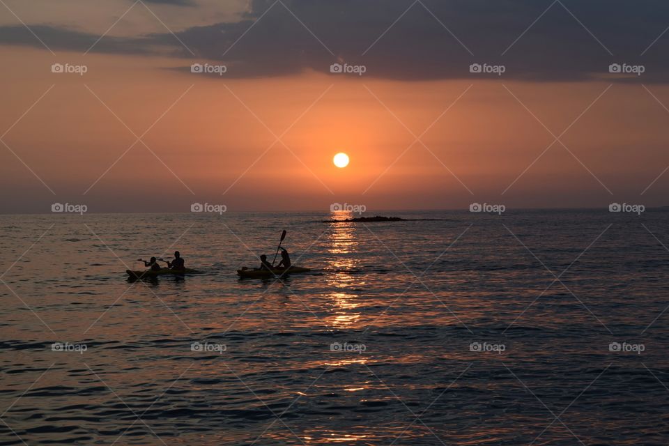 Greece summer sunset canoeing. Greece summer sunset canoeing
