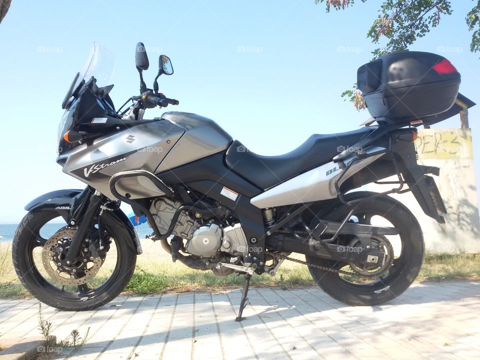 V strom motorbike on the beach