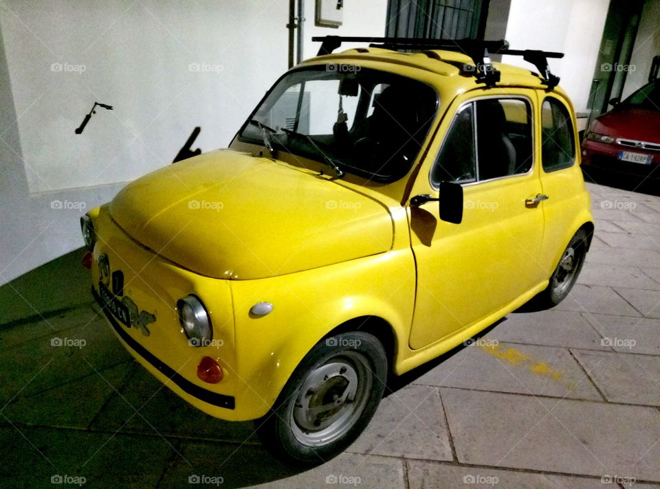 Old yellow car in Presicce, Italy