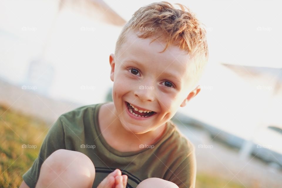 Boy smiling while enjoying summer