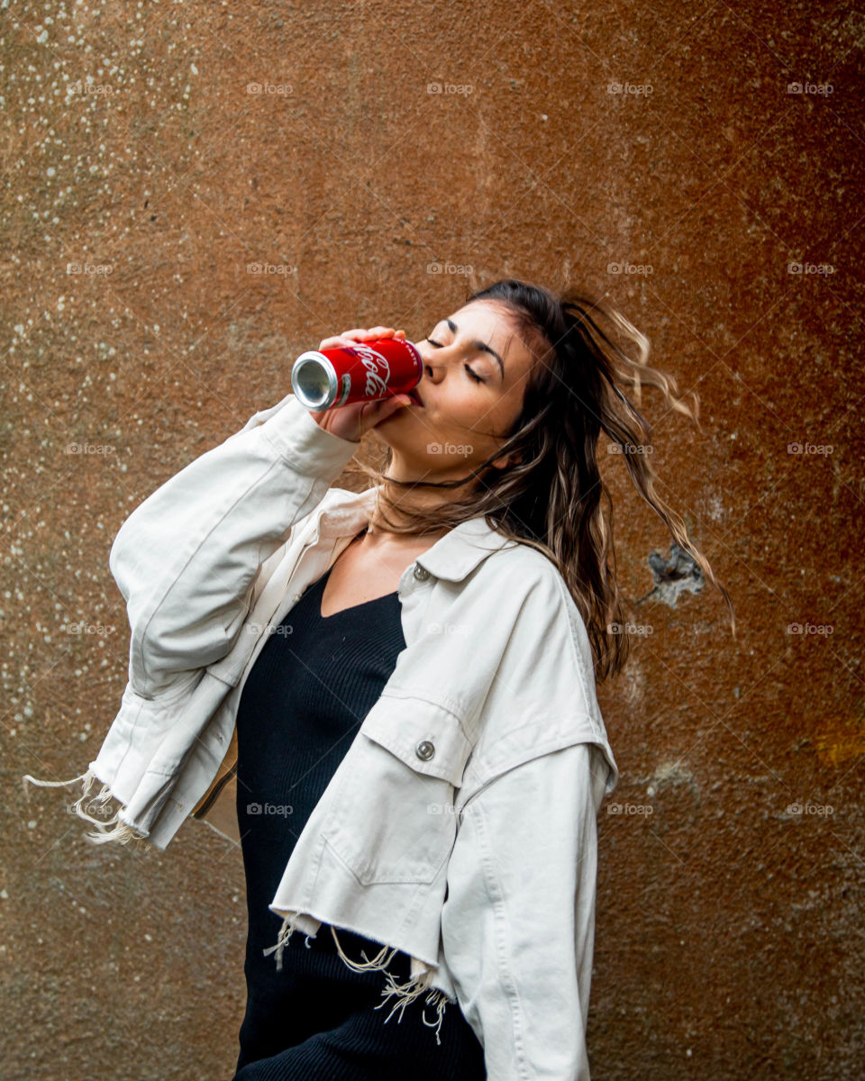Drinking Coca Cola on a windy day exploring aome ruins.