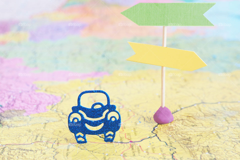 blue paper cars on the map next to the signs.