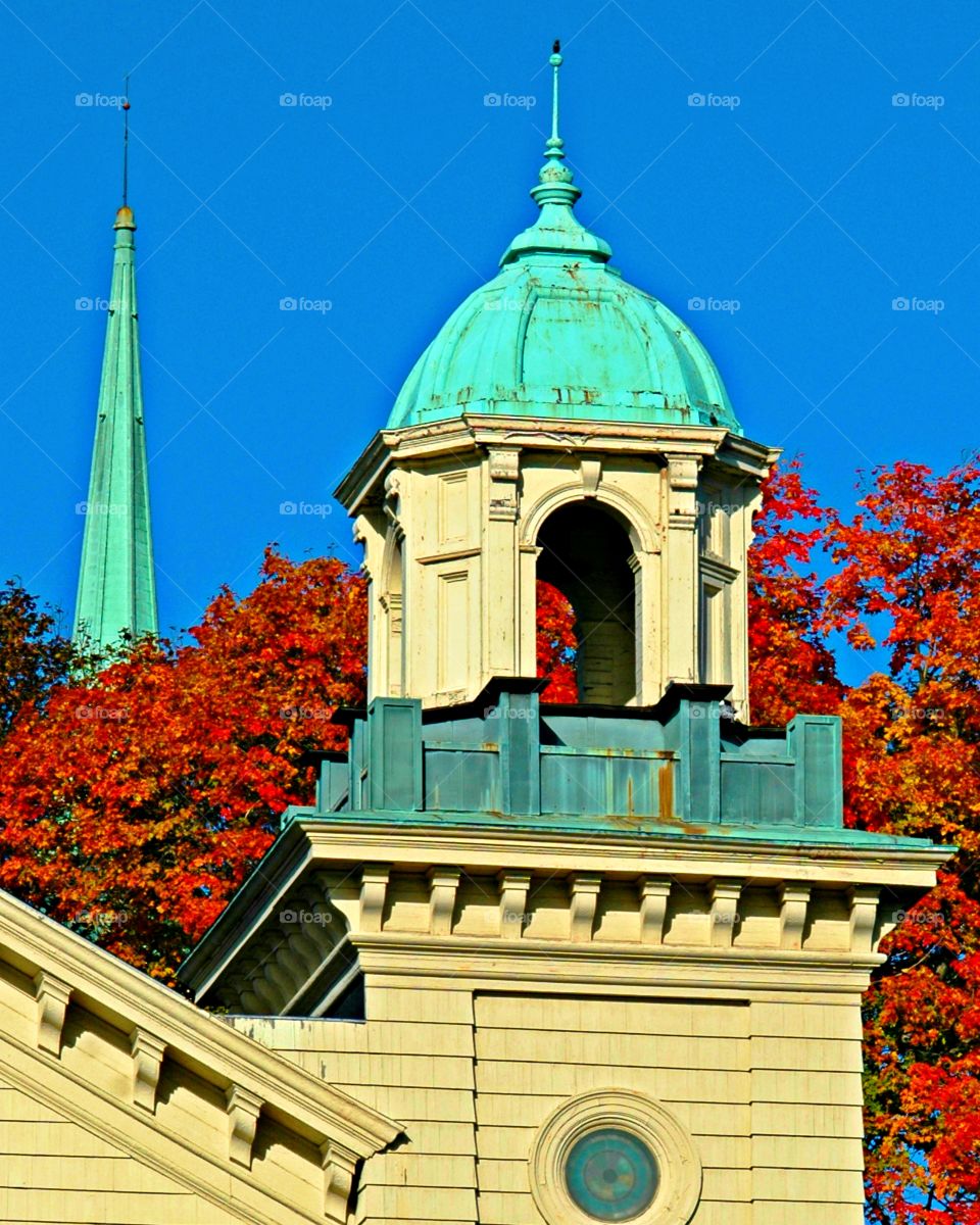 First signs of autumn - Brightly colored autumn leaves adorn the cathedral architecture 