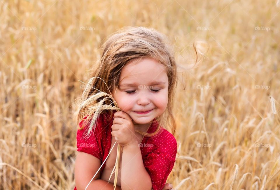 Cute little girl in the field 