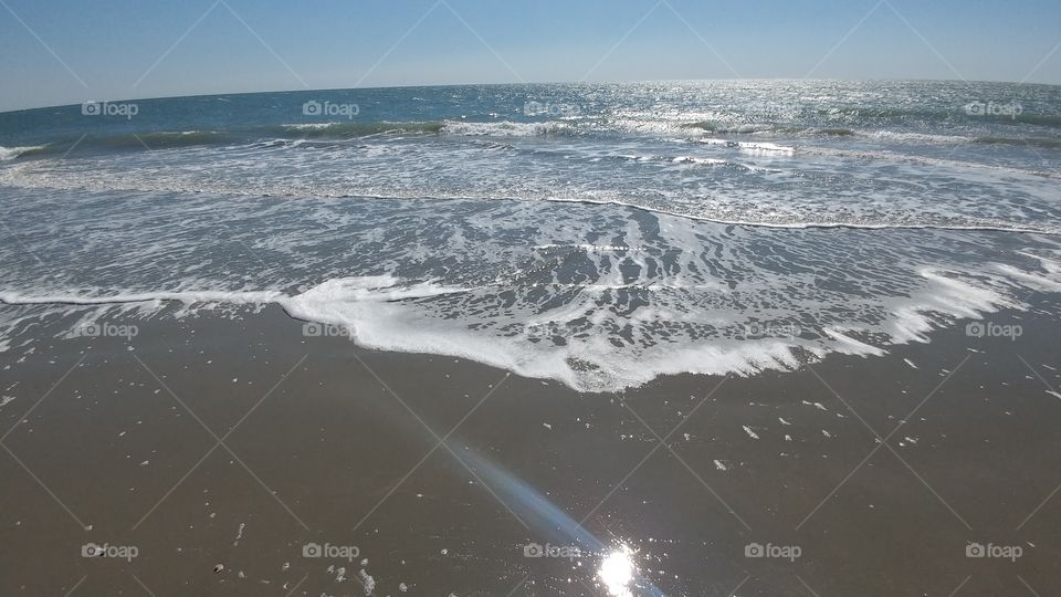 ocean waves breaking on shore
