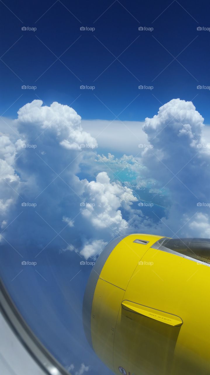 Airplane motor between the clouds