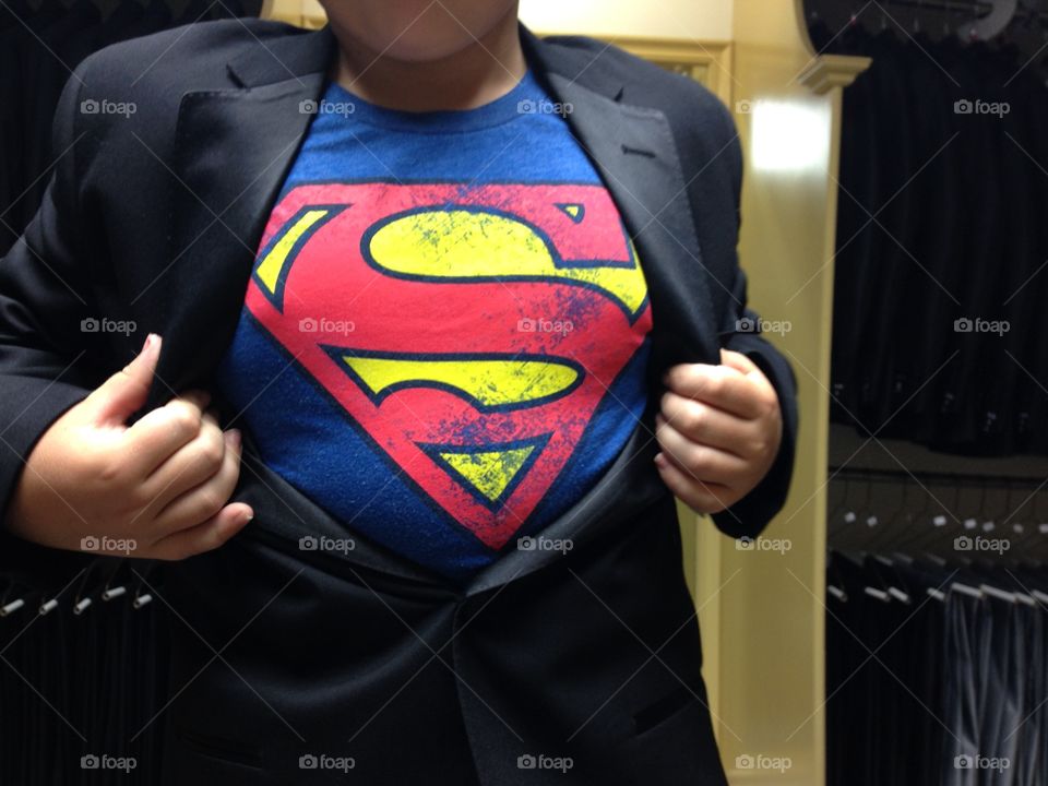 Superman hero. Superhero kid opens jacket to reveal superman logo shirt