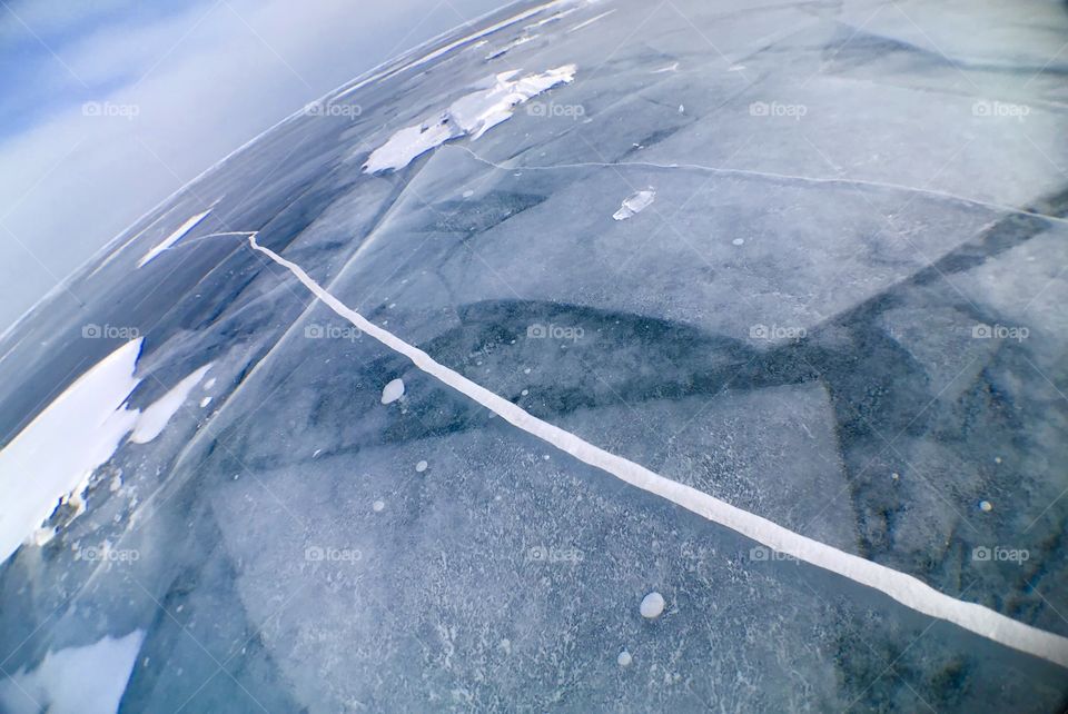 Love that pattern layers beneath and big attractive crack above. Deep down there seem mistery...but if you want to discover...you might become like bubbles