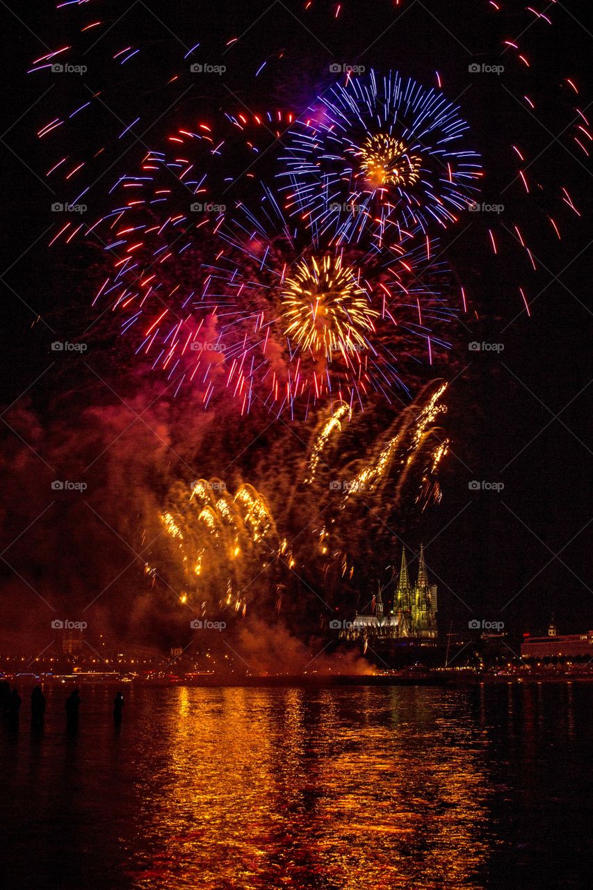 Explosion of fireworks in sky at night