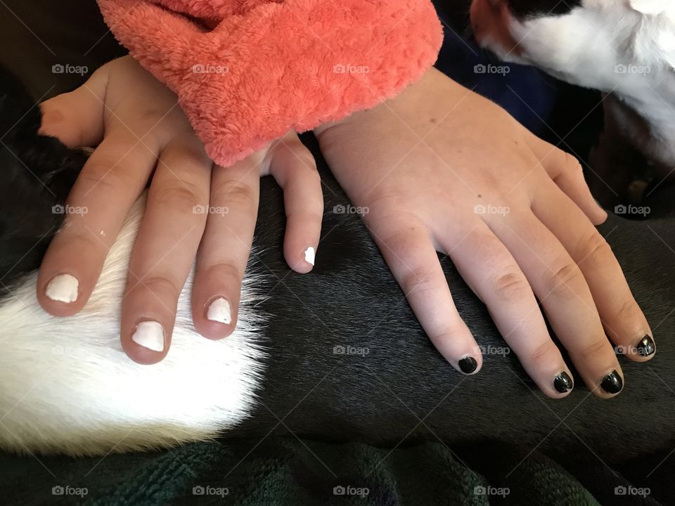 My youngest daughter got a manicure to match the Boston Terriers. She’s showing off her nails by crossing her hands on the pups back so she has white on white and black on black! Too cute!