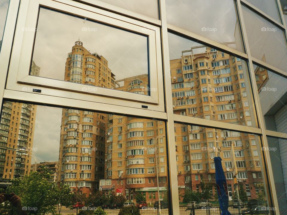 incredible reflection in the window of the building