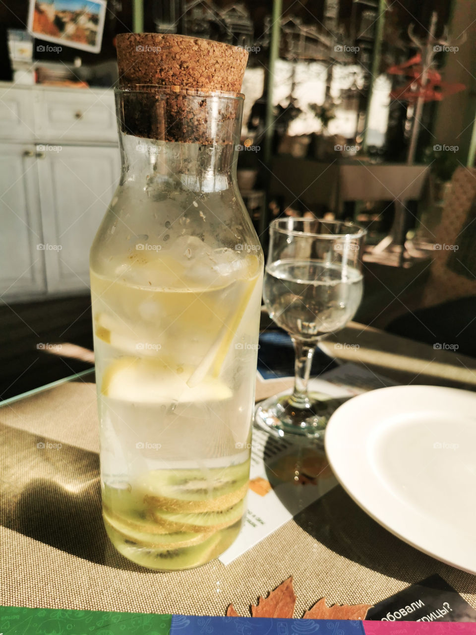 Bottle lemonade lemon table served view inside joy happy glass drink yummy healthy view vegan focus juicy fruits