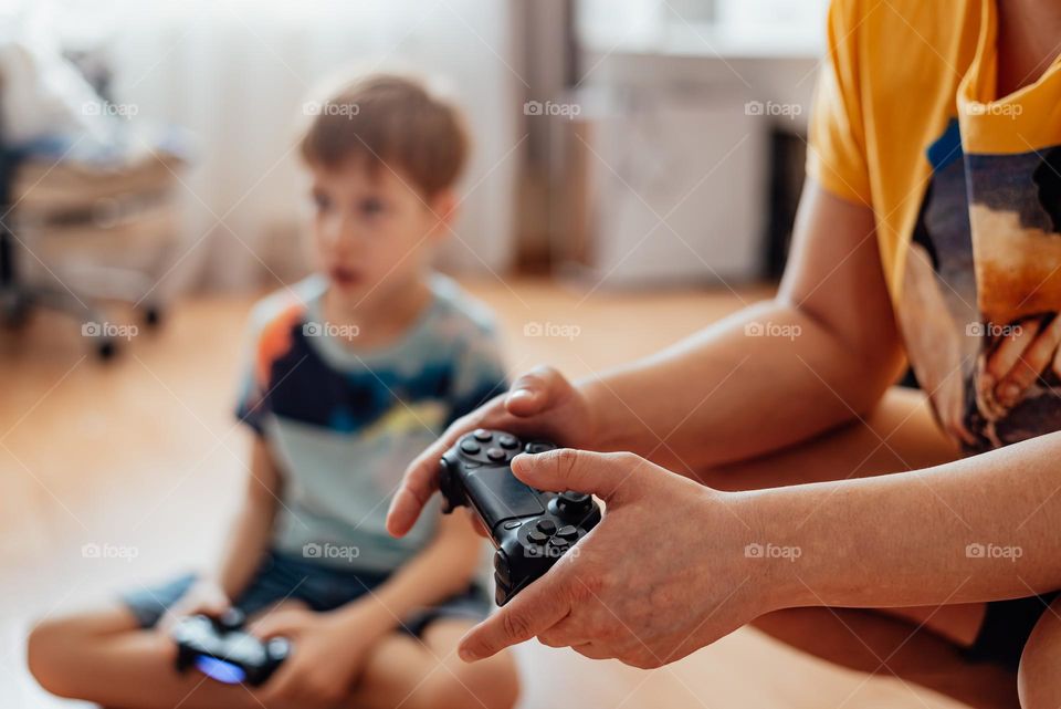 Boy and dad playing video game 