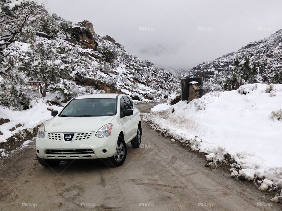 Rogue. This is my first car (Nissan Rogue), that I didn't own, posing in front of some snowy mountains. 