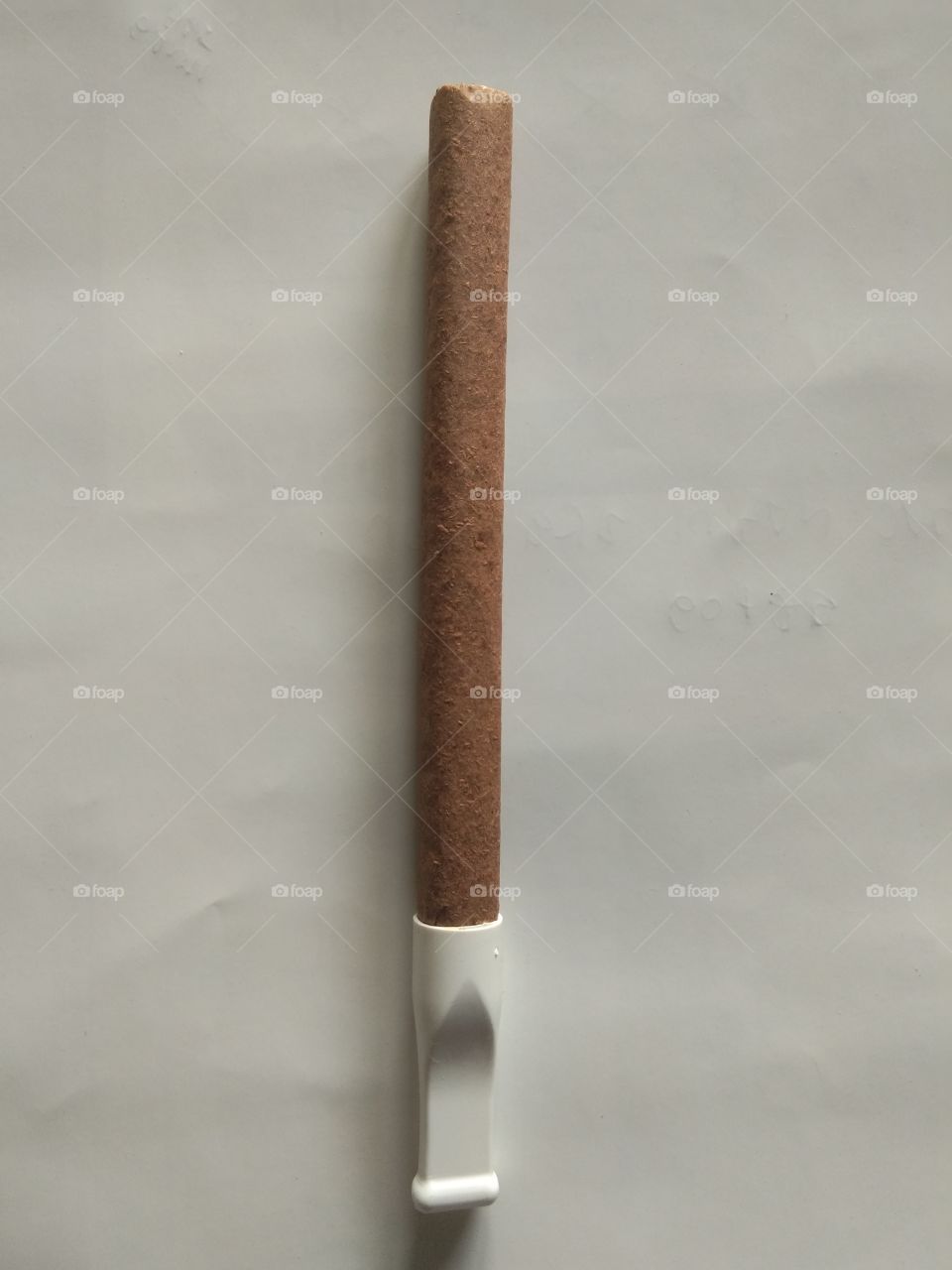 cigar with a white background